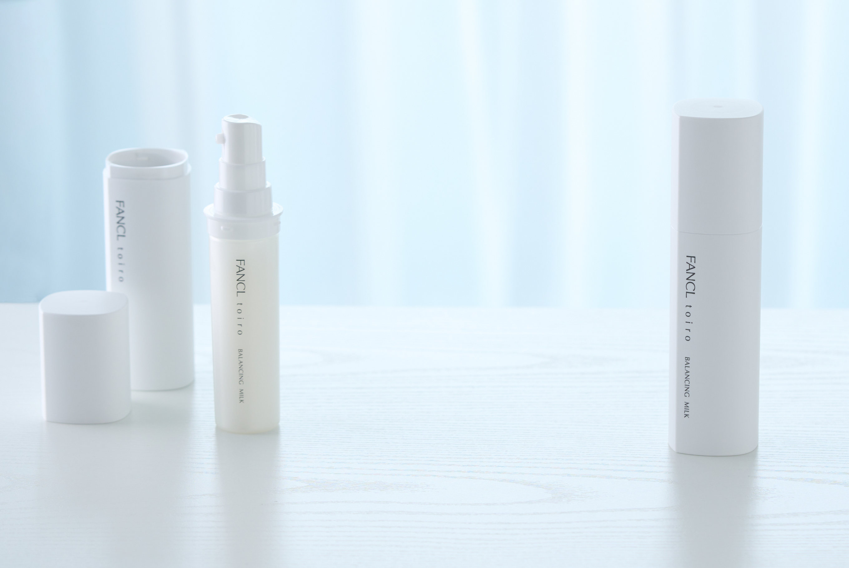 Two FANCL balancing milk bottles, showcasing how the product cartridge can be removed. 