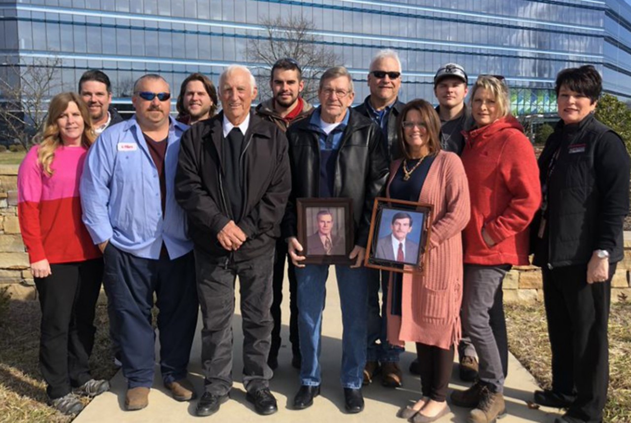 The Gibson family in front of Eastman corporate building 
