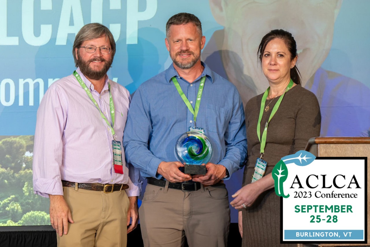 Jason Pierce holds an award recognizing his LCA expertise 